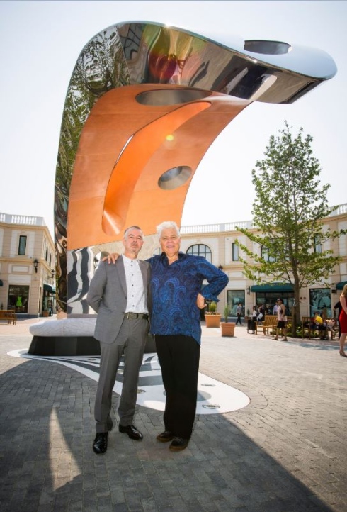 Michael Nicoll Yahgulanaas and Barry Gilson in front of SEI at McArthurGlen Outlet Mall at the Vancouver International Airport, by Y Public Art